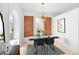 Modern dining room with exposed brick, stylish lighting, and contemporary decor at 2515 Zenobia St, Denver, CO 80212