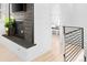 Hallway with access to the stairs and a view into a mud room at 2515 Zenobia St, Denver, CO 80212