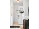 Bright foyer with light hardwood floors and a stylish front door with a wreath at 2515 Zenobia St, Denver, CO 80212