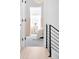 Hallway with hardwood floors leading to bedroom with wainscoting at 2515 Zenobia St, Denver, CO 80212