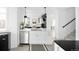 Modern kitchen featuring stainless steel appliances and adjacent living space at 2515 Zenobia St, Denver, CO 80212