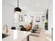 Open concept living space adjacent to kitchen with neutral decor at 2515 Zenobia St, Denver, CO 80212