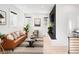 Cozy living room with a fireplace and neutral toned furniture at 2515 Zenobia St, Denver, CO 80212