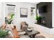 Living room with modern fireplace and comfortable seating area at 2515 Zenobia St, Denver, CO 80212