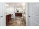 This bathroom boasts double vanities, tile floors, walk-in shower, and separate tub at 27029 E Irish Pl, Aurora, CO 80016