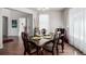 Well-lit dining room with wood floors, decorated dining table and plant decorations at 27029 E Irish Pl, Aurora, CO 80016