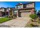 Picture of a brick home featuring a well-maintained lawn, landscaping, and attached garage at 27029 E Irish Pl, Aurora, CO 80016