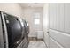 Modern laundry room featuring high-end washer and dryer and neutral paint at 27029 E Irish Pl, Aurora, CO 80016