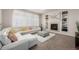 Inviting living room with a fireplace, built-in shelving, and comfortable sectional sofa at 27029 E Irish Pl, Aurora, CO 80016