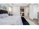 The main bedroom features neutral walls, bedside lamps, and a tray ceiling with a chandelier at 27029 E Irish Pl, Aurora, CO 80016
