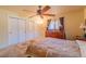 Bedroom with neutral carpet, ceiling fan, decorative window treatments, and a closet at 430 Long View Ct, Longmont, CO 80501