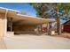 Attached carport featuring brick accents and a covered area for parking and protection from the elements at 430 Long View Ct, Longmont, CO 80501