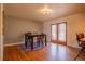 Spacious dining room with hardwood floors and sliding glass doors to the backyard at 430 Long View Ct, Longmont, CO 80501