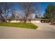 Charming single-story home with a lush front yard and a spacious two-car garage at 430 Long View Ct, Longmont, CO 80501