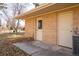Back of home with brick and two exterior doors in backyard at 430 Long View Ct, Longmont, CO 80501
