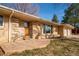 Charming front porch with stone and brick accents, offering a warm welcome to the home at 430 Long View Ct, Longmont, CO 80501
