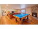 Game room with pool table and a comfortable seating area for entertaining guests at 430 Long View Ct, Longmont, CO 80501