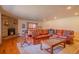 Inviting game room with a leather sofa, fireplace, and a pool table for entertainment at 430 Long View Ct, Longmont, CO 80501
