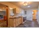 Bright laundry room with front load washer/dryer, ample cabinetry, and tile flooring at 430 Long View Ct, Longmont, CO 80501