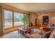 Inviting living room boasts natural light, hardwood floors, and comfortable seating at 430 Long View Ct, Longmont, CO 80501
