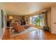 Bright living room featuring hardwood floors and a large window providing ample natural light at 430 Long View Ct, Longmont, CO 80501
