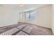 Bright bedroom with three windows and carpet floors at 17962 E 103Rd Ave, Commerce City, CO 80022