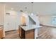 Modern kitchen island featuring granite countertops and stainless steel sink at 17962 E 103Rd Ave, Commerce City, CO 80022
