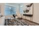 Cozy living area with chic furnishings, wood flooring, and lots of natural light, ideal for relaxing at 17962 E 103Rd Ave, Commerce City, CO 80022