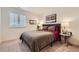 Comfortable bedroom featuring an accent wall, plush carpeting, and plantation shutters at 16135 Mountain Flax Dr, Monument, CO 80132