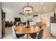 Inviting living room with modern furnishings, open floor plan, and well-lit dining area at 16135 Mountain Flax Dr, Monument, CO 80132