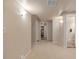 Basement hallway featuring neutral carpet leading to a closet and bathroom at 13545 W 62Nd Ln, Arvada, CO 80004