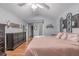 Spacious main bedroom with vaulted ceilings, hardwood floors, neutral decor and ensuite bathroom at 13545 W 62Nd Ln, Arvada, CO 80004
