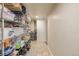 Well-stocked basement storage room with shelving and ample space for organization at 13545 W 62Nd Ln, Arvada, CO 80004