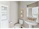 Small bathroom with white cabinets and granite countertop at 3705 Yale Dr, Broomfield, CO 80023