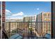 Relaxing balcony space offering clear views of city buildings and vibrant blue skies at 1700 Bassett St # 609, Denver, CO 80202
