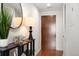 Inviting hallway featuring modern decor and a stylish entryway table with a mirror at 1700 Bassett St # 609, Denver, CO 80202