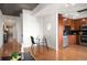 Open-concept kitchen with hardwood floors, stainless steel appliances, and a dining area at 1700 Bassett St # 609, Denver, CO 80202