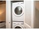 Convenient, in-unit laundry closet with stacked LG washer and dryer and louvered doors at 1700 Bassett St # 609, Denver, CO 80202