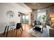 Living room features hardwood floors, modern furniture, and outdoor balcony access at 1700 Bassett St # 609, Denver, CO 80202