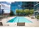 Outdoor pool with lounge chairs and surrounding landscaped views at 1700 Bassett St # 609, Denver, CO 80202