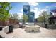 Rooftop terrace with outdoor kitchen, fire pit, seating, and city views at 1700 Bassett St # 609, Denver, CO 80202