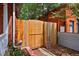 Backyard gate constructed of wood with stylish vertical panels at 482 S Logan St, Denver, CO 80209