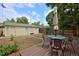 Inviting backyard area featuring an outdoor seating area and detached garage at 482 S Logan St, Denver, CO 80209