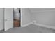 A new bedroom with fresh paint and plush carpet features an exterior door and window at 482 S Logan St, Denver, CO 80209