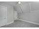 Bright bedroom featuring plush gray carpet, white trim, a ceiling fan, and white paneled doors at 482 S Logan St, Denver, CO 80209