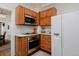 A well-organized kitchen features wood cabinets, stainless steel appliances, and a white refrigerator at 482 S Logan St, Denver, CO 80209