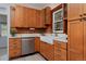 Charming kitchen with warm wood cabinets and modern appliances at 482 S Logan St, Denver, CO 80209