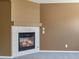 Close-up of a fireplace featuring tile surround and neutral mantel at 5572 Kalispell St, Denver, CO 80239