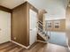 Inviting home foyer with staircase leading to an open floor plan at 5572 Kalispell St, Denver, CO 80239