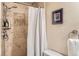 Bathroom showcasing a shower with decorative stone and a framed piece of artwork at 2838 Decatur St, Denver, CO 80211